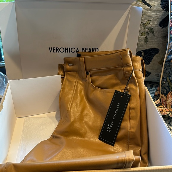 Carly vegan leather kick flare pants. Color is cognac - size 28. Value is $298. - Picture 1 of 2